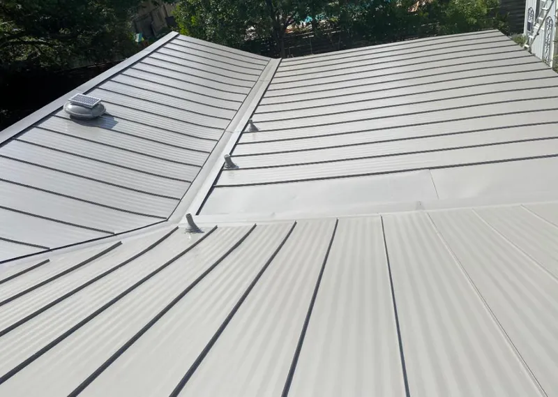 Solar attic fan installed on a metal roof for Roof Ventilation in Boulder Creek